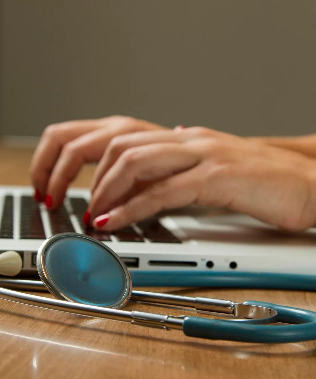 Clinician reviewing AI-assisted diagnostics